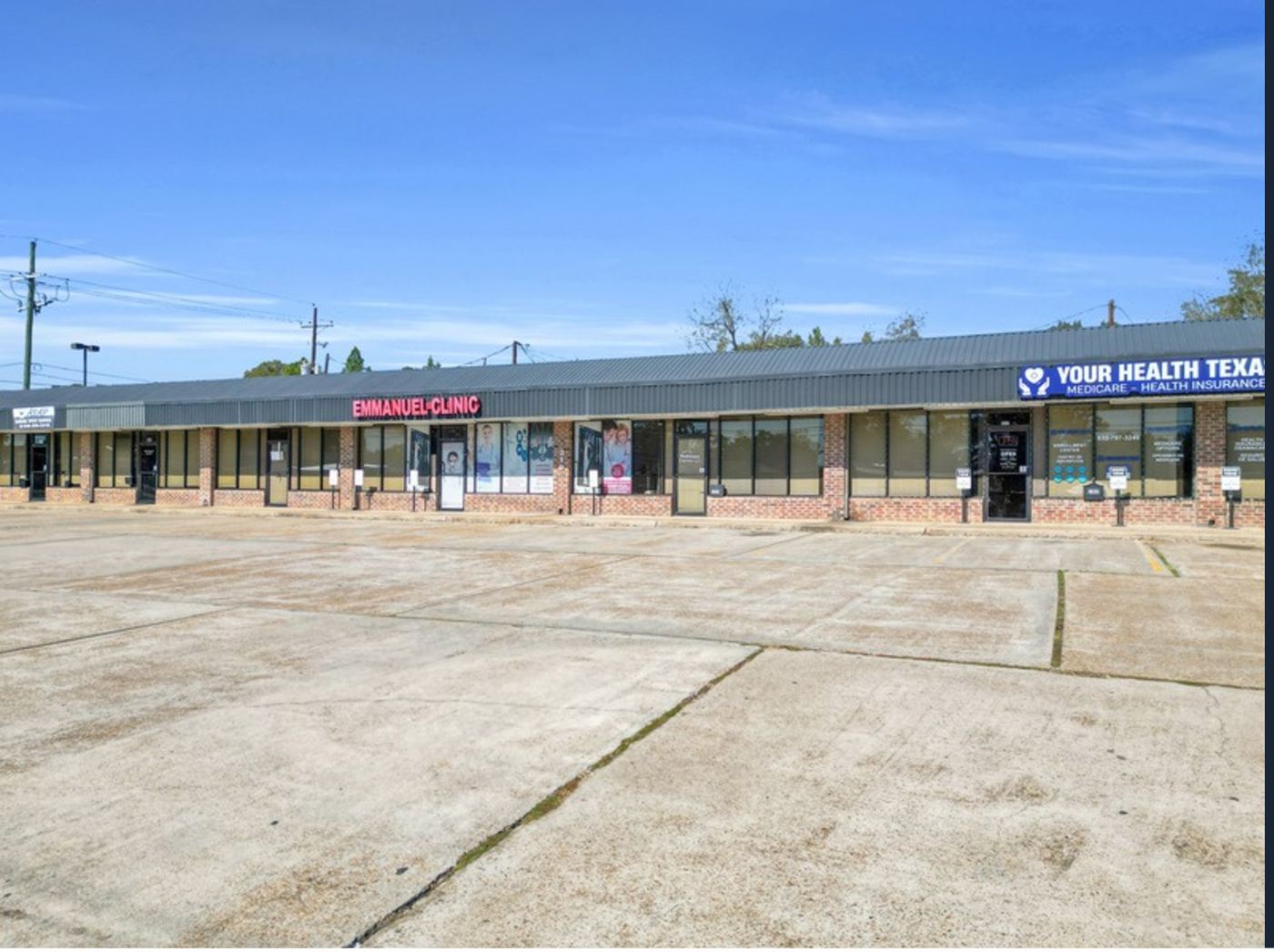 Storefront elevation of a multi-suite commercial center in downtown Conroe, Texas
