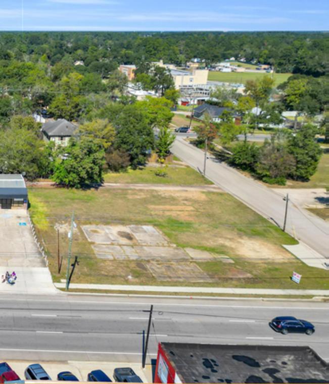Aerial looking east over 310 E Davis St and the surrounding downtown Conroe blocks